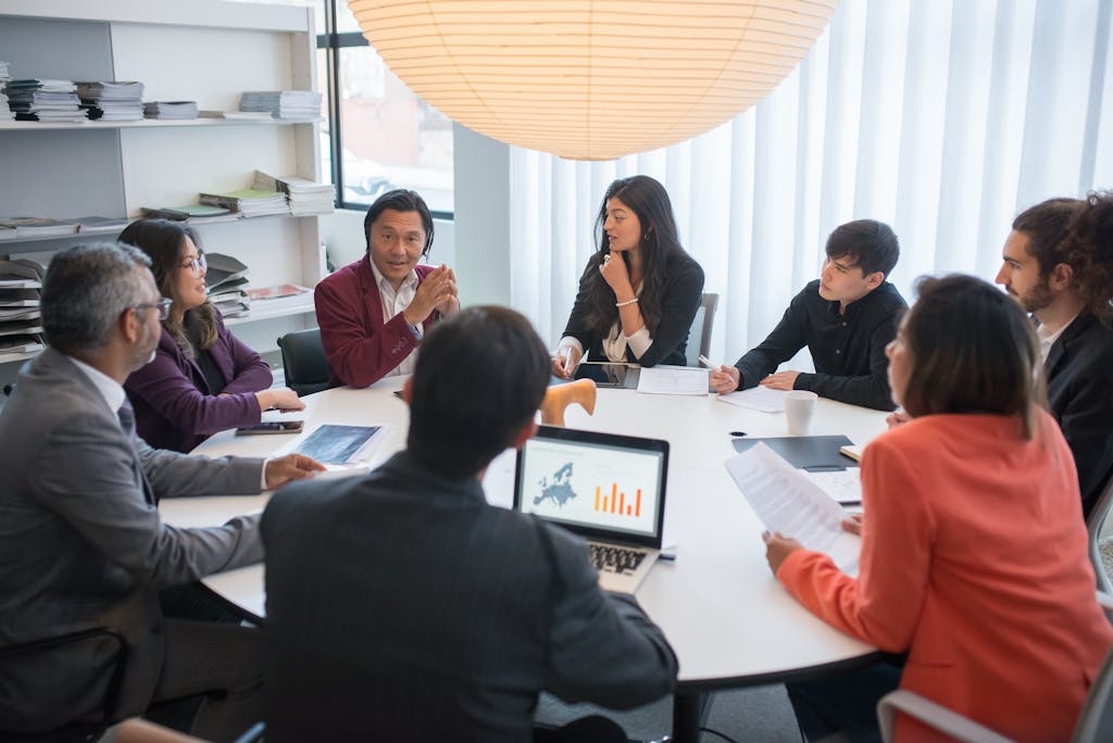 Team of accountants collaborating around a desk