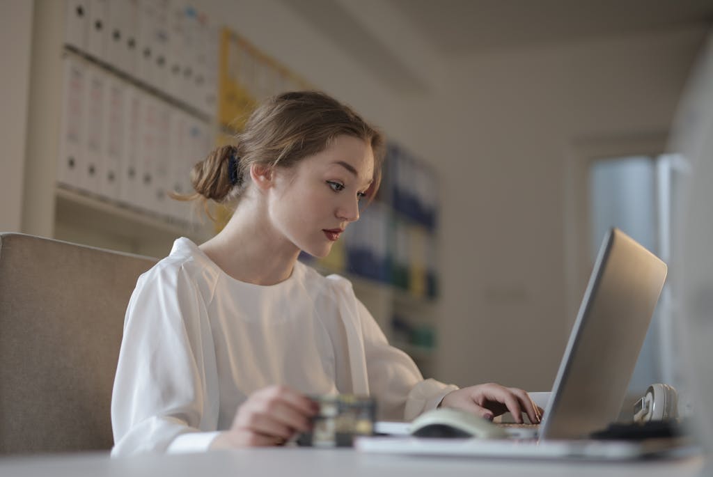 Female Accountant working using Laptop doing Management Accounting