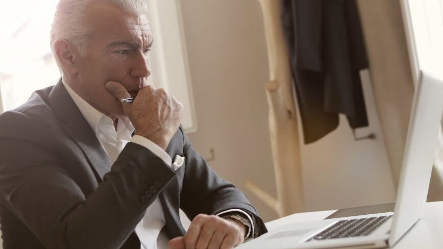 Register as a Beneficial Owner RBO Man in white Suite