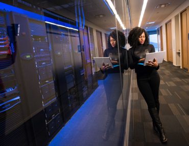Data center women holding laptop